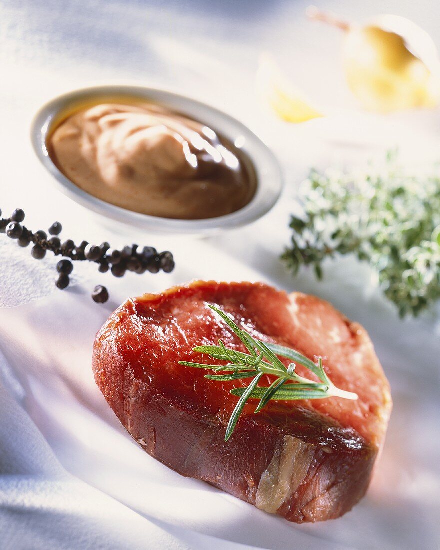 Beef steak with rosemary, pepper and spicy sauce