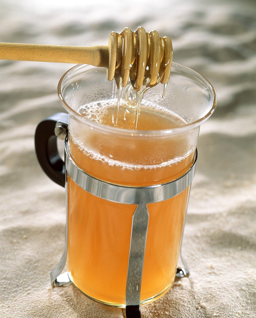 Glass of grog with honey