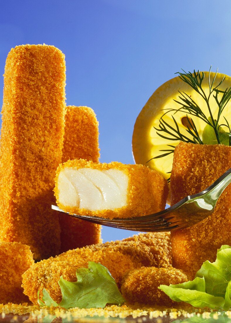 Fish fingers, one on fork