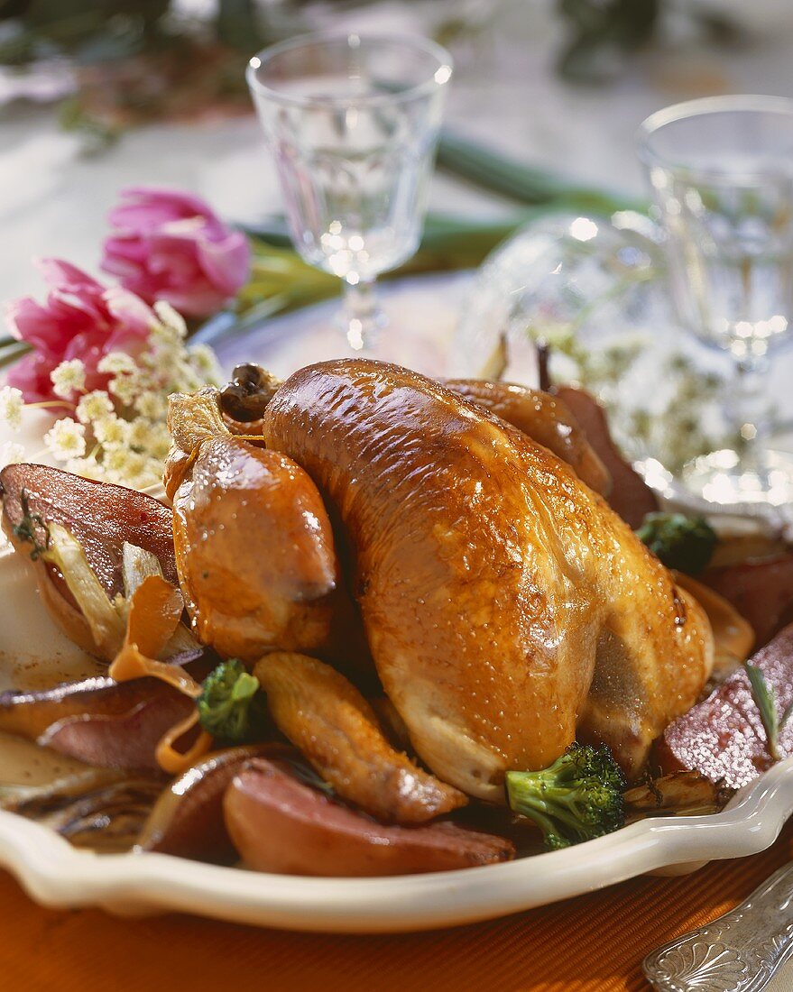 Guinea-fowl with pears on large plate