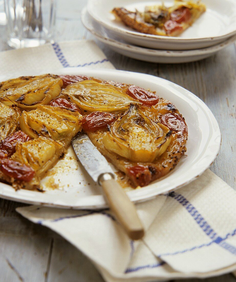 Fennel tart with tomatoes (a piece cut)