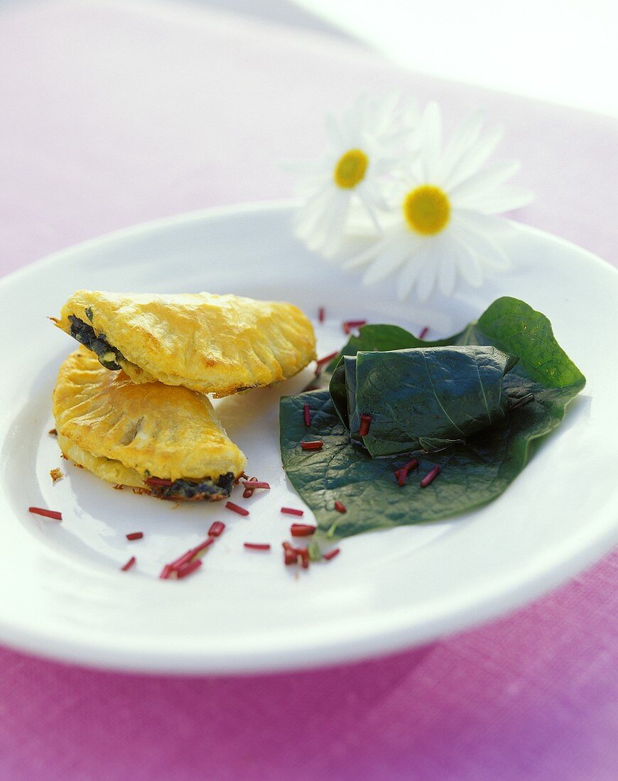 Goat's cheese pasties with puff pastry, stuffed vine leaves