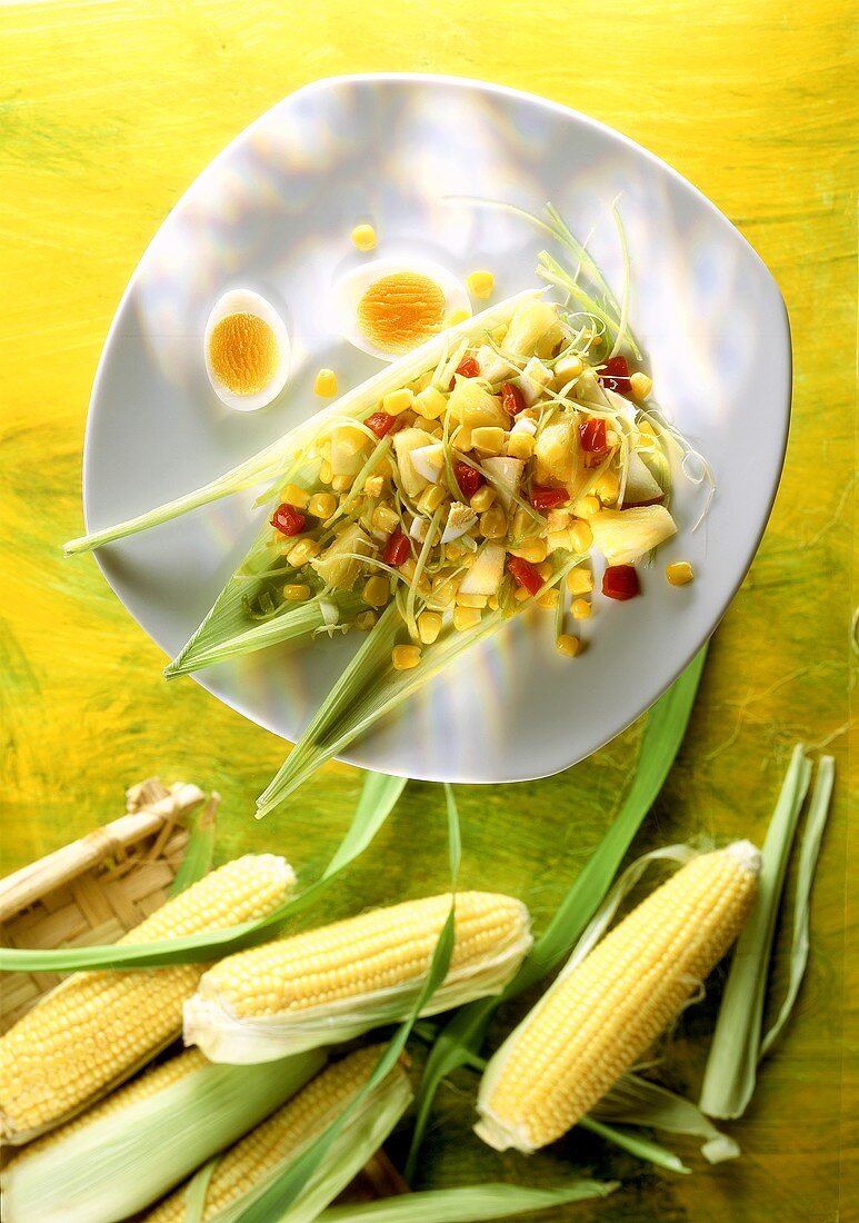Summery sweetcorn salad with boiled eggs and pineapple