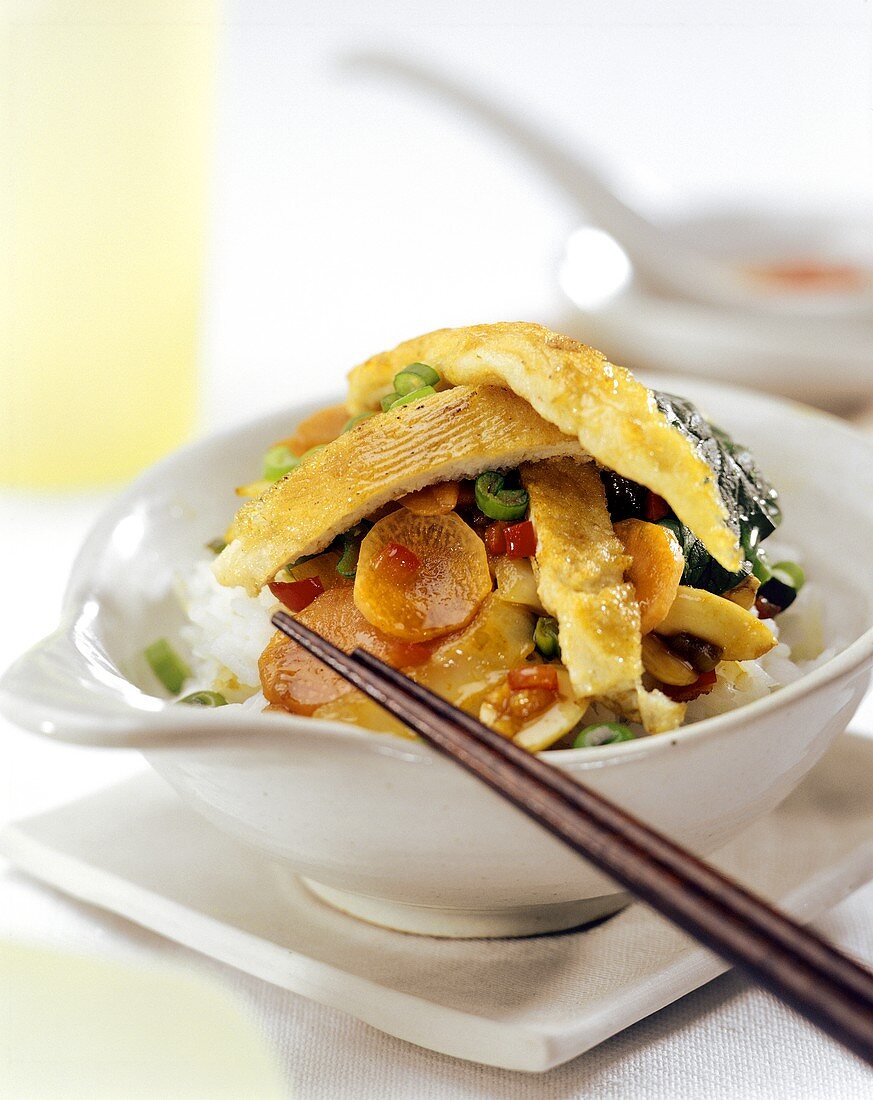 Rice with vegetables and strips of omelette