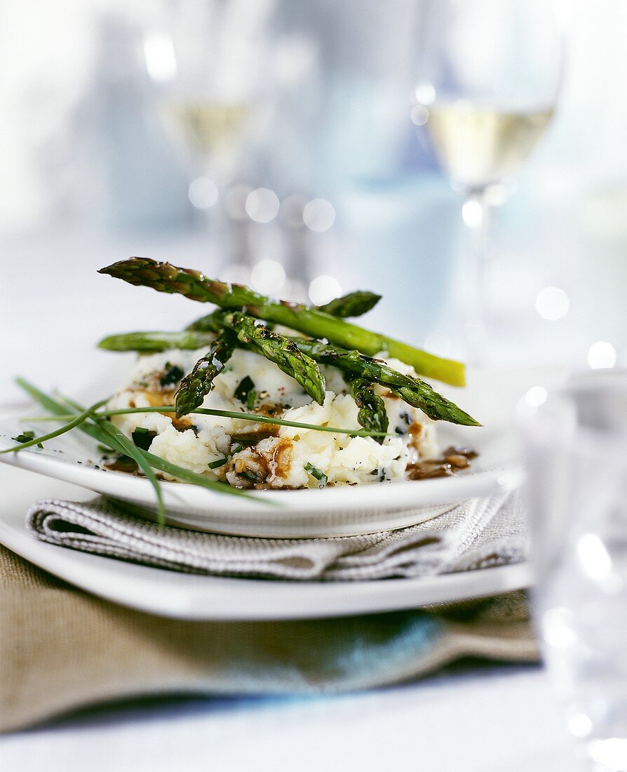 Truffled mashed potato with green asparagus and sauce