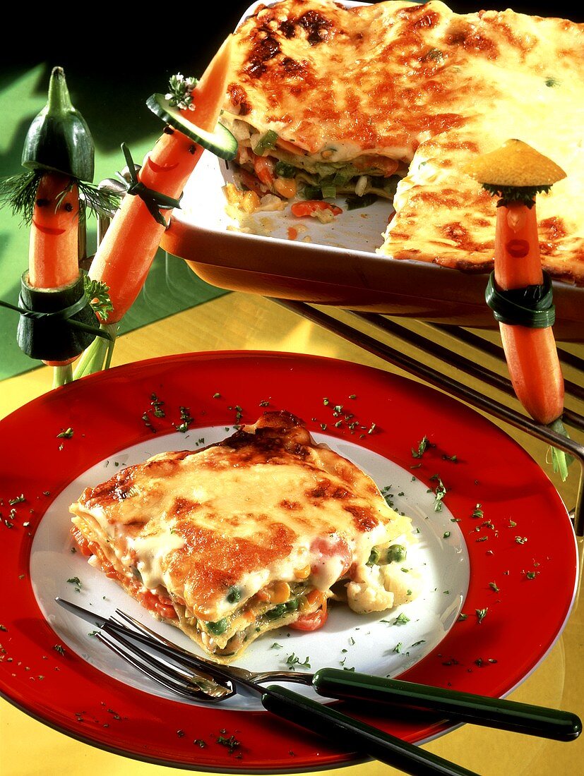 Vegetable lasagne with carrot figures for children