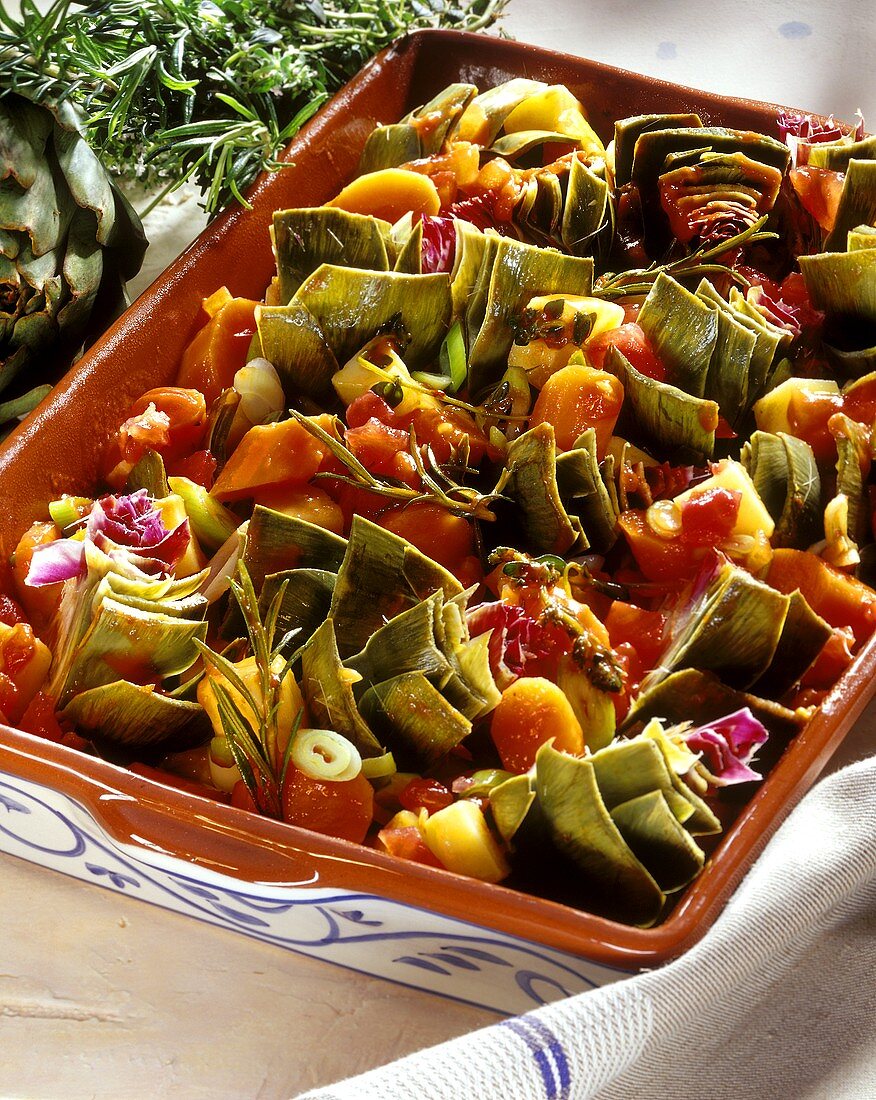 Oven-baked artichokes and potatoes with carrots