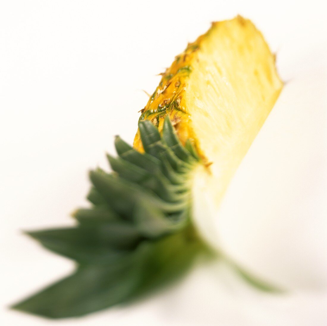 Quarter of a pineapple with leaves