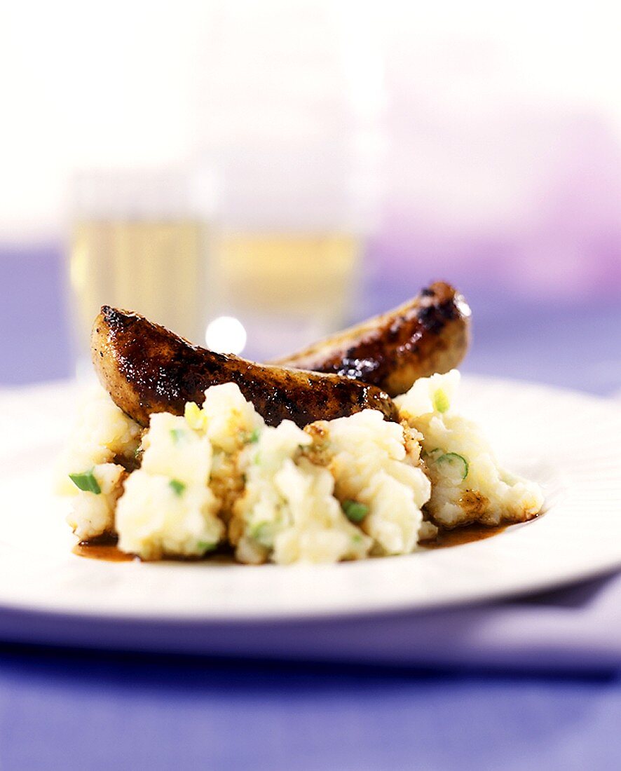 Veal sausages on mashed potatoes