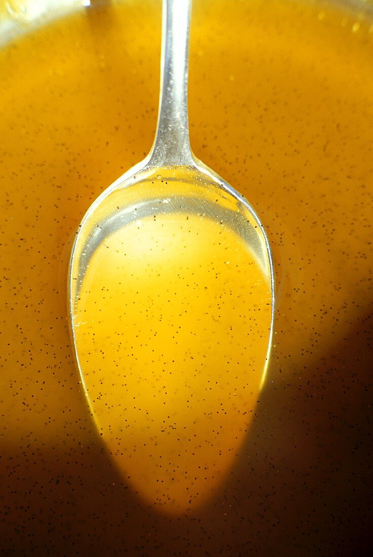 Fruit sauce with vanilla on spoon