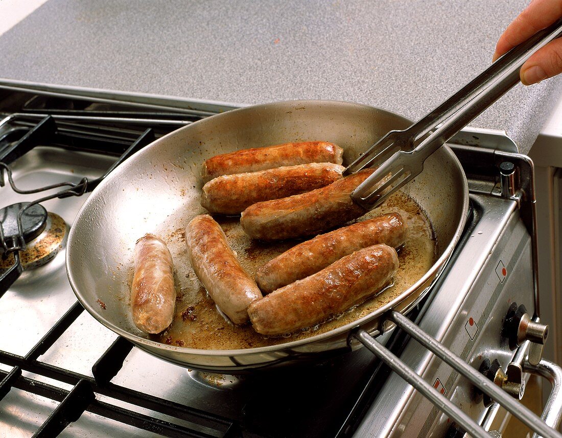 Frying sausages in the pan