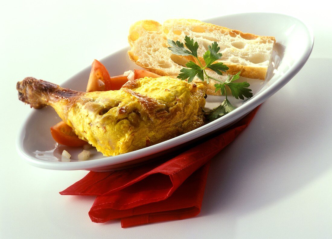 Tandoori chicken with white bread and tomatoes