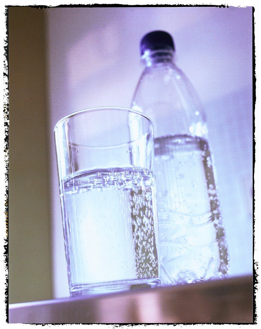 Mineral water in glass and plastic bottle
