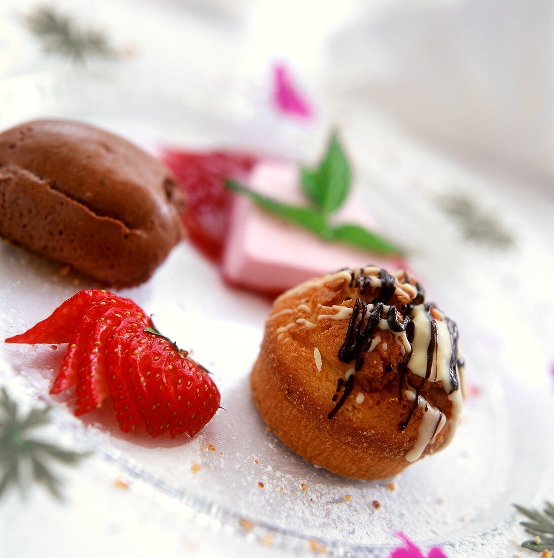 Dessert plates: chocolate mousse, cream puff, strawberry ice