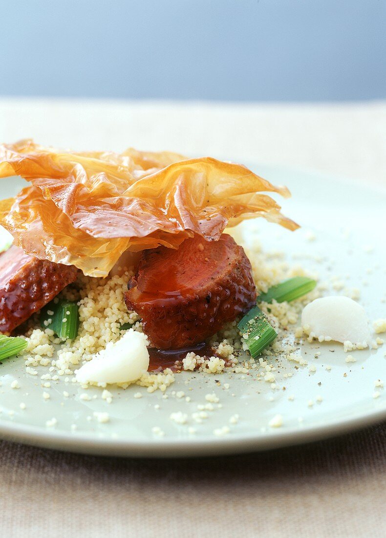 Duck breast with couscous and baklava topping