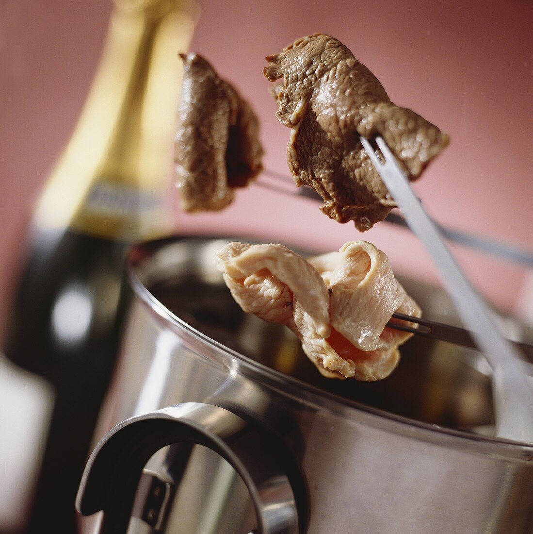Champagne fondue with meat and turkey