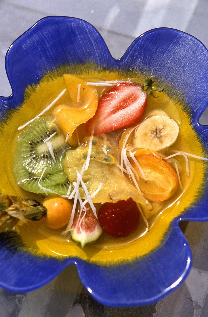 Exotic fruit salad in flower-shaped bowl