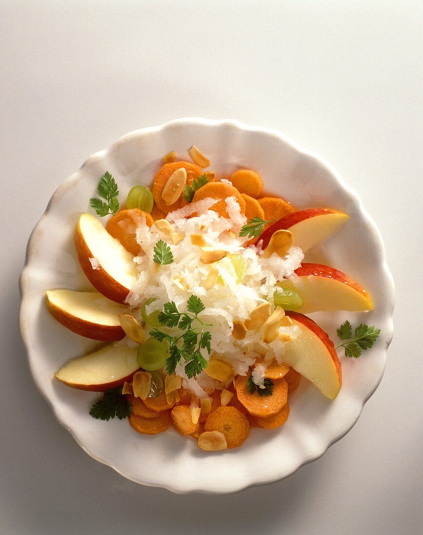 Carrot and radish salad with apple wedges and almonds