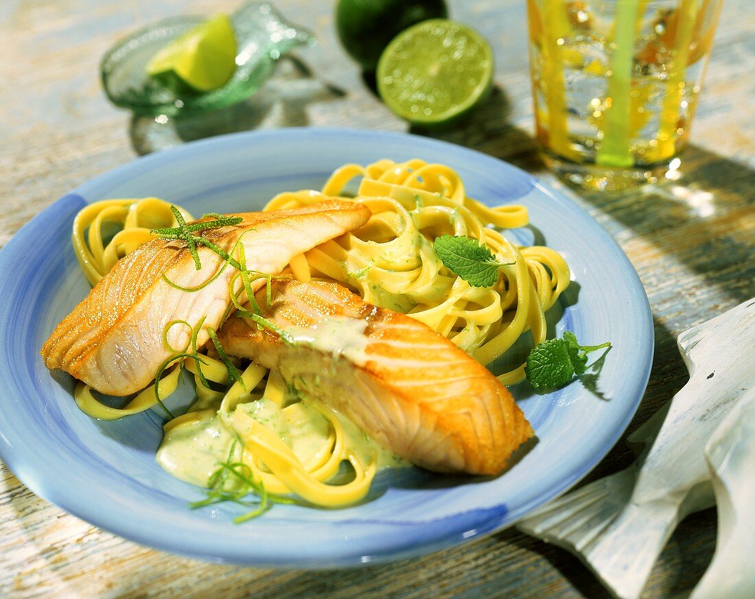 Fried salmon fillets with ribbon pasta and lime sauce