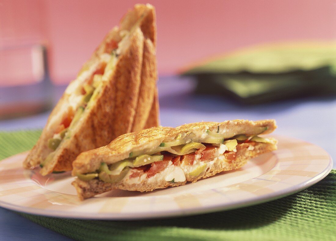 Olive, pepper and sheep's cheese toasted sandwich