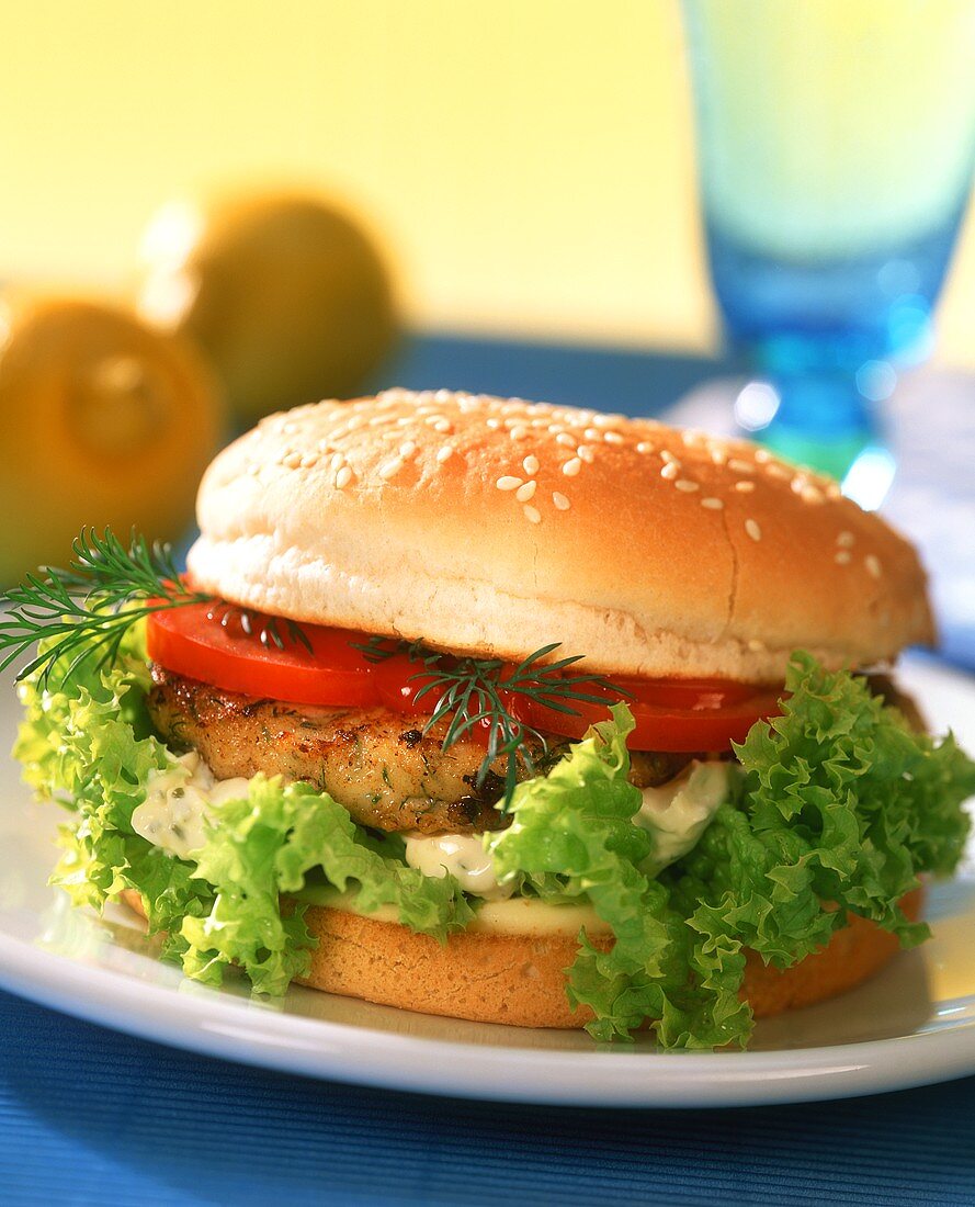 Fish burger with tomatoes and lettuce