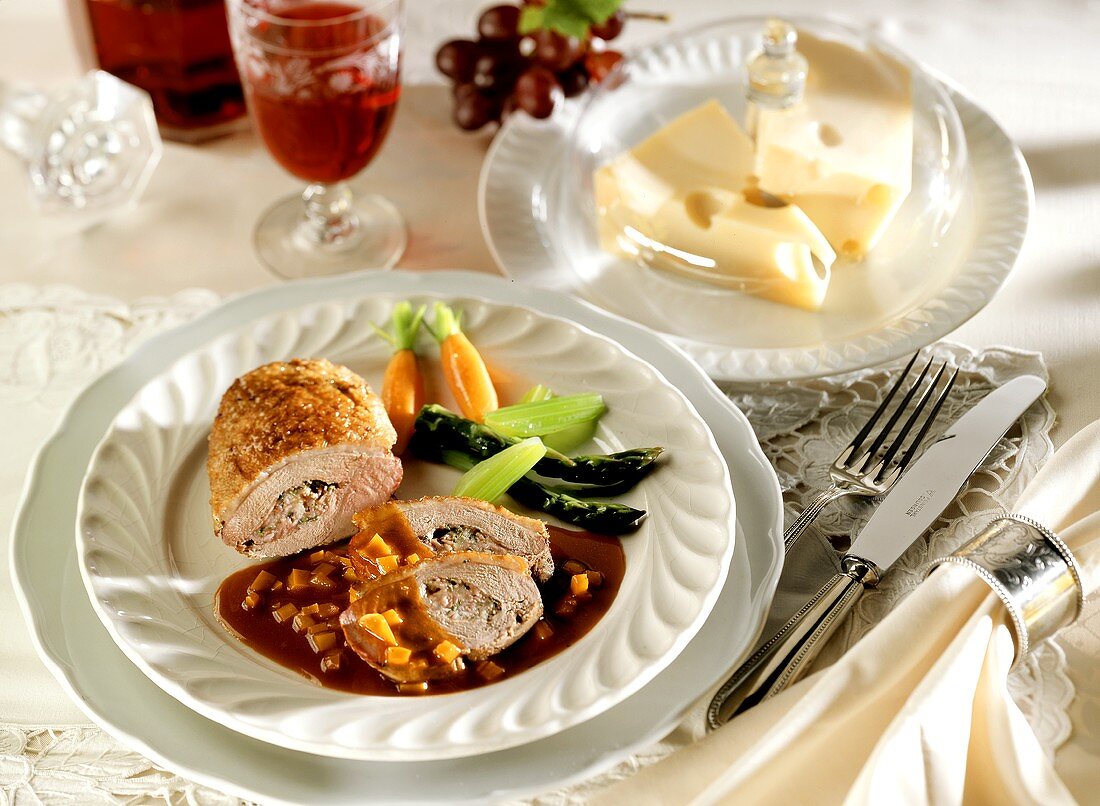 Stuffed duck breast in red wine sauce; Emmental cheese