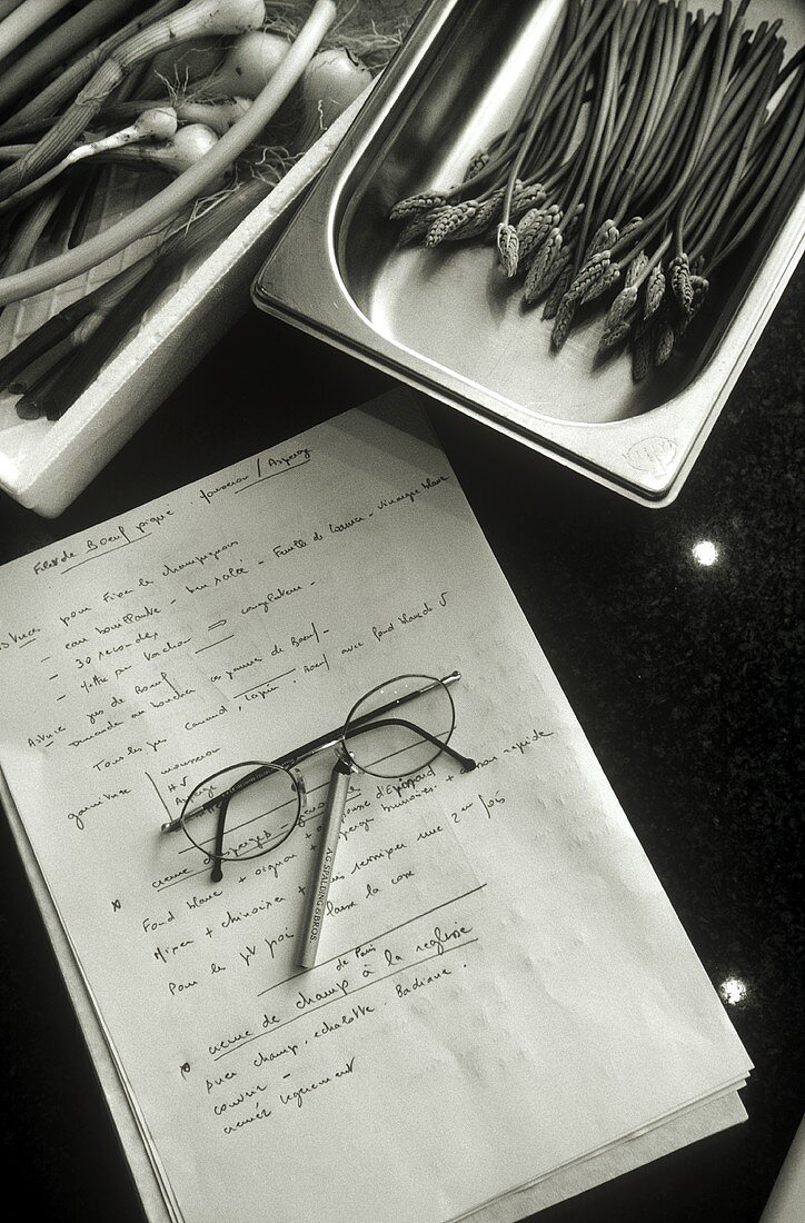 Still life with vegetables, recipe, spectacles and pencil