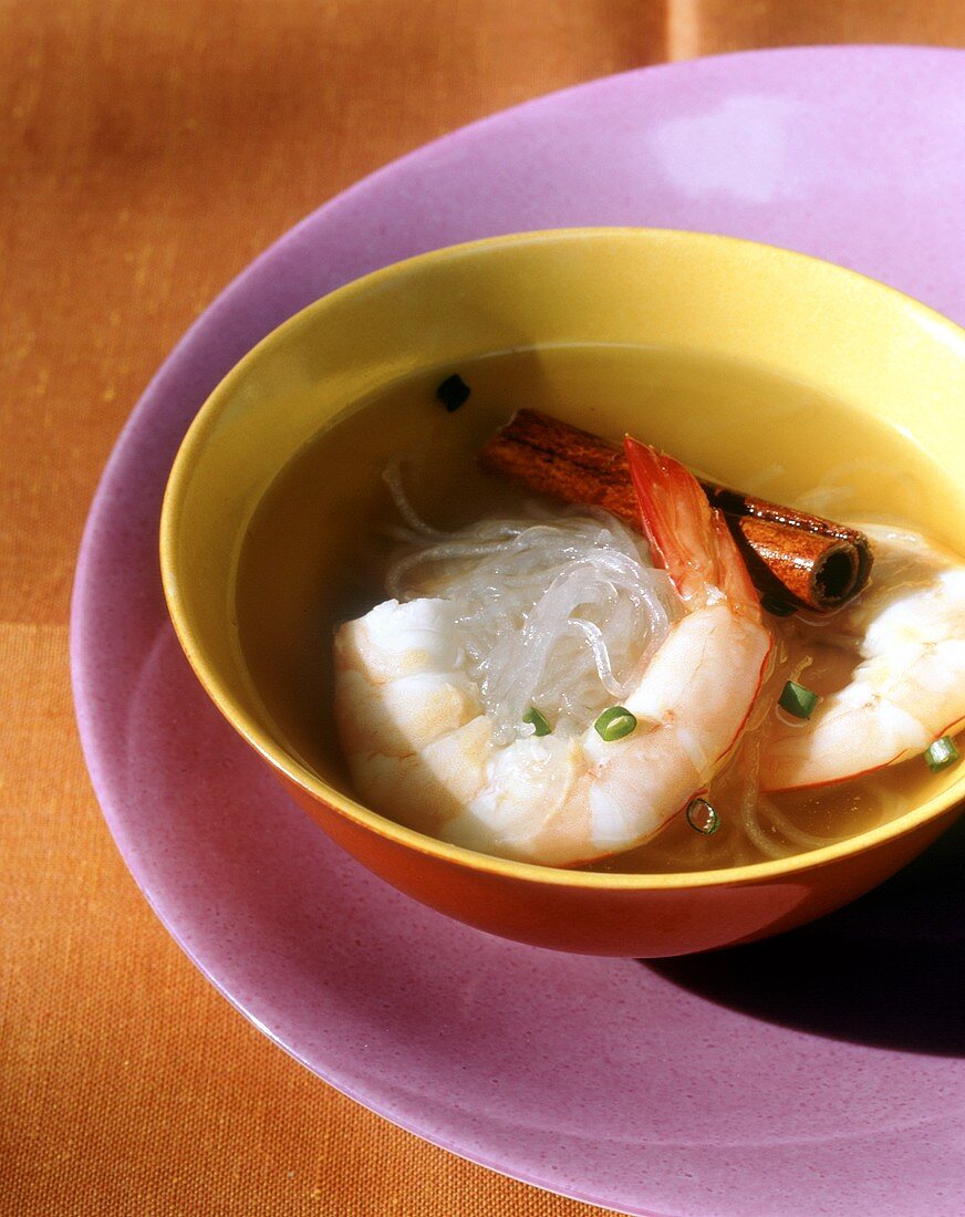 Rice noodle and shrimp soup with cinnamon stick