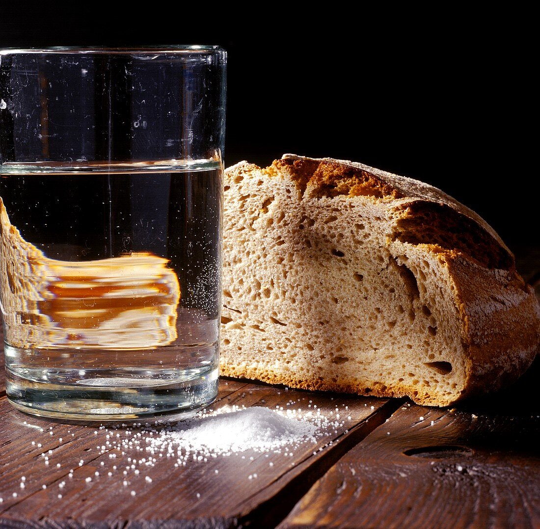 Farmhouse bread, salt and glass of water