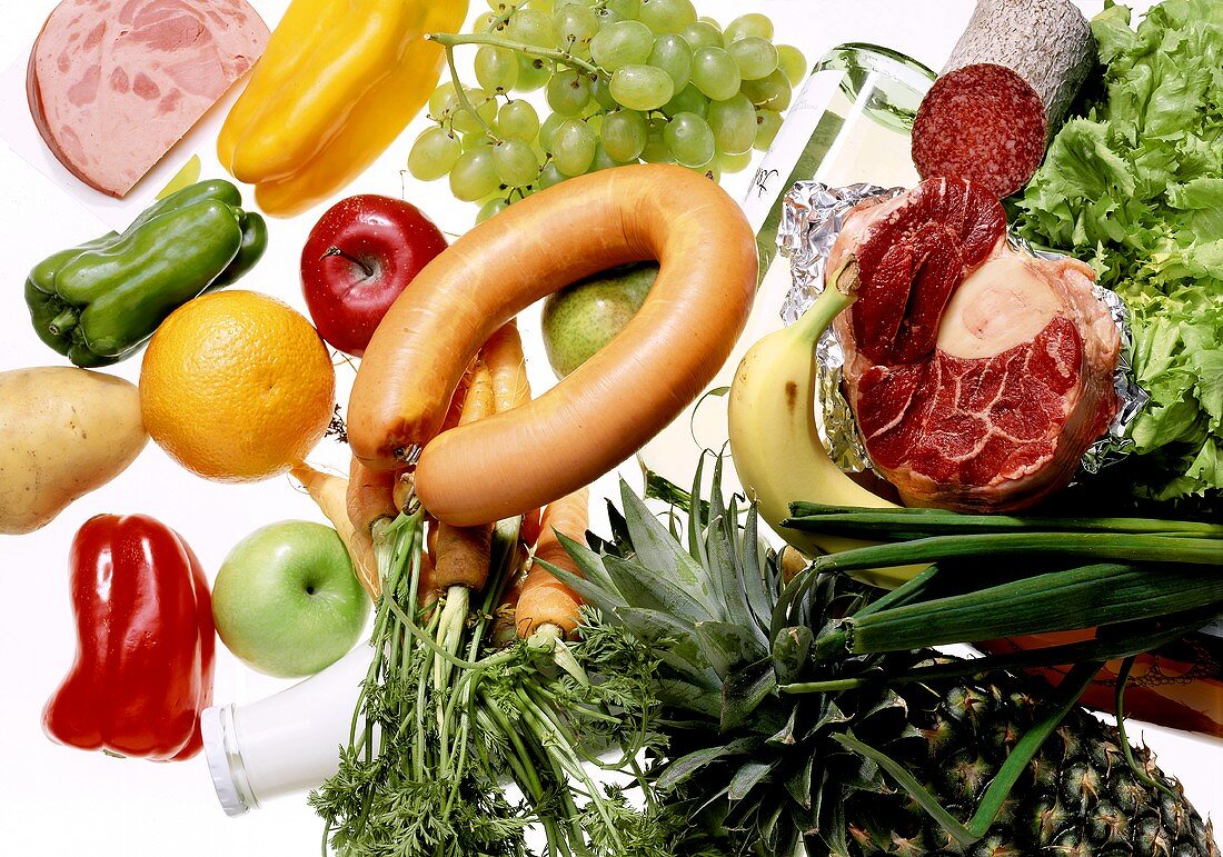 Still life with fruit, vegetables, sausage, meat, milk & wine
