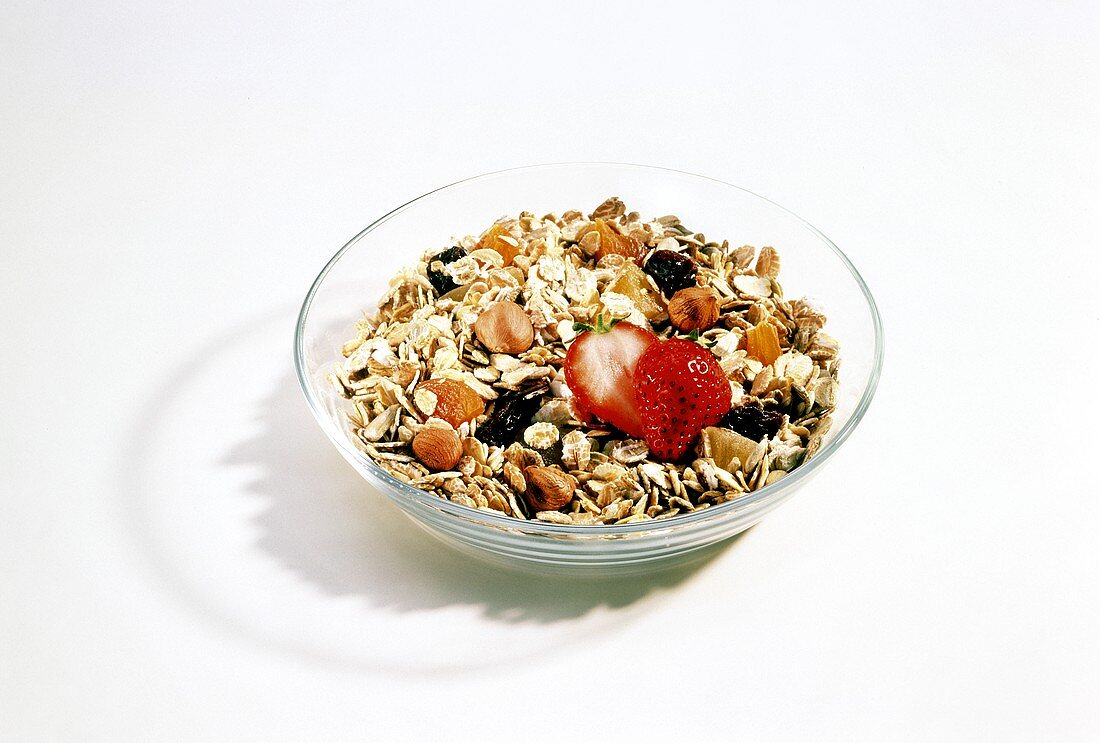 Muesli with dried fruit and fresh strawberry
