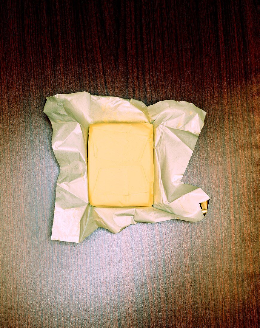 Piece of butter on foil-backed paper