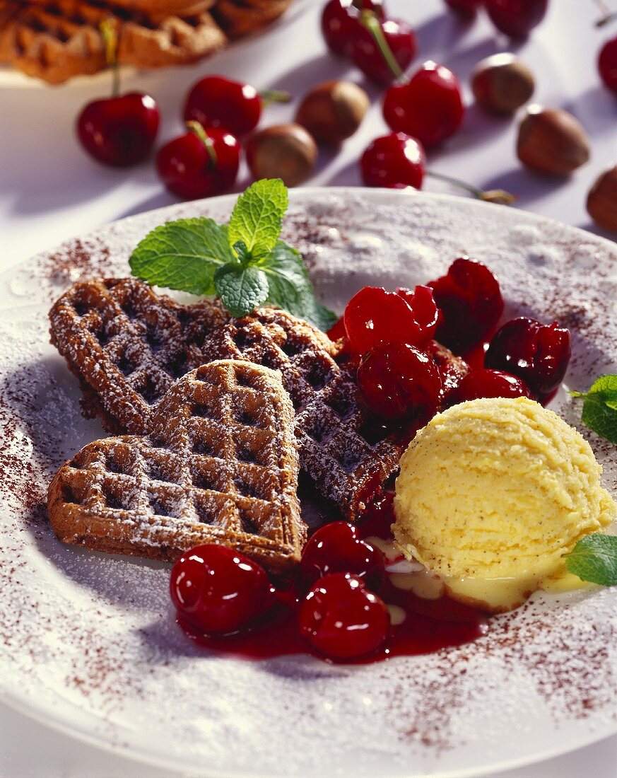 Nut waffles with cherry ragout and vanilla ice cream