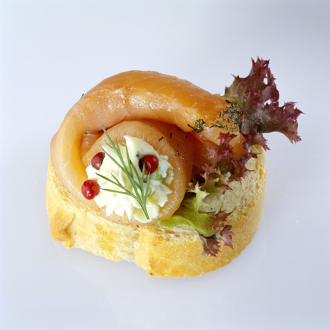 Canapé with salmon, with lettuce garnish