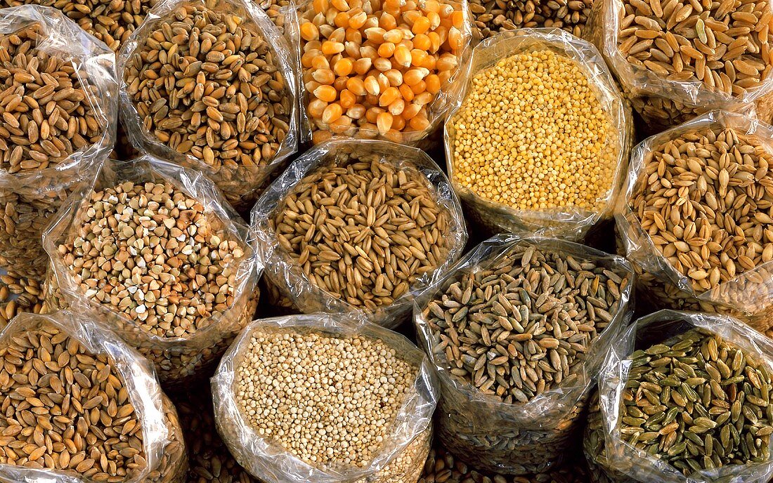 Various types of cereals in plastic bags (filling the picture)