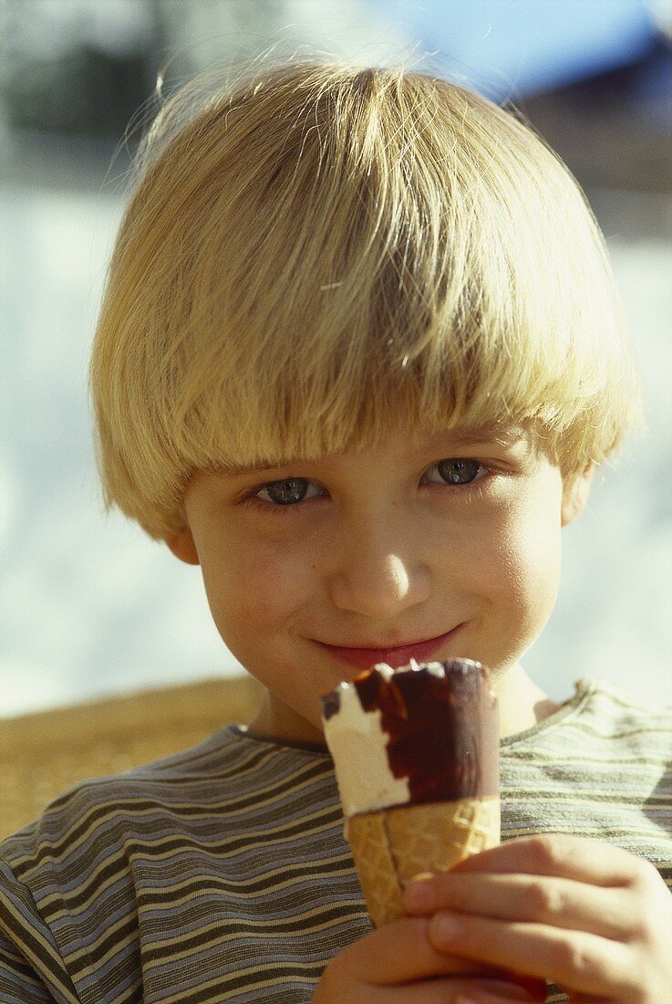 Small boy eating ice cream