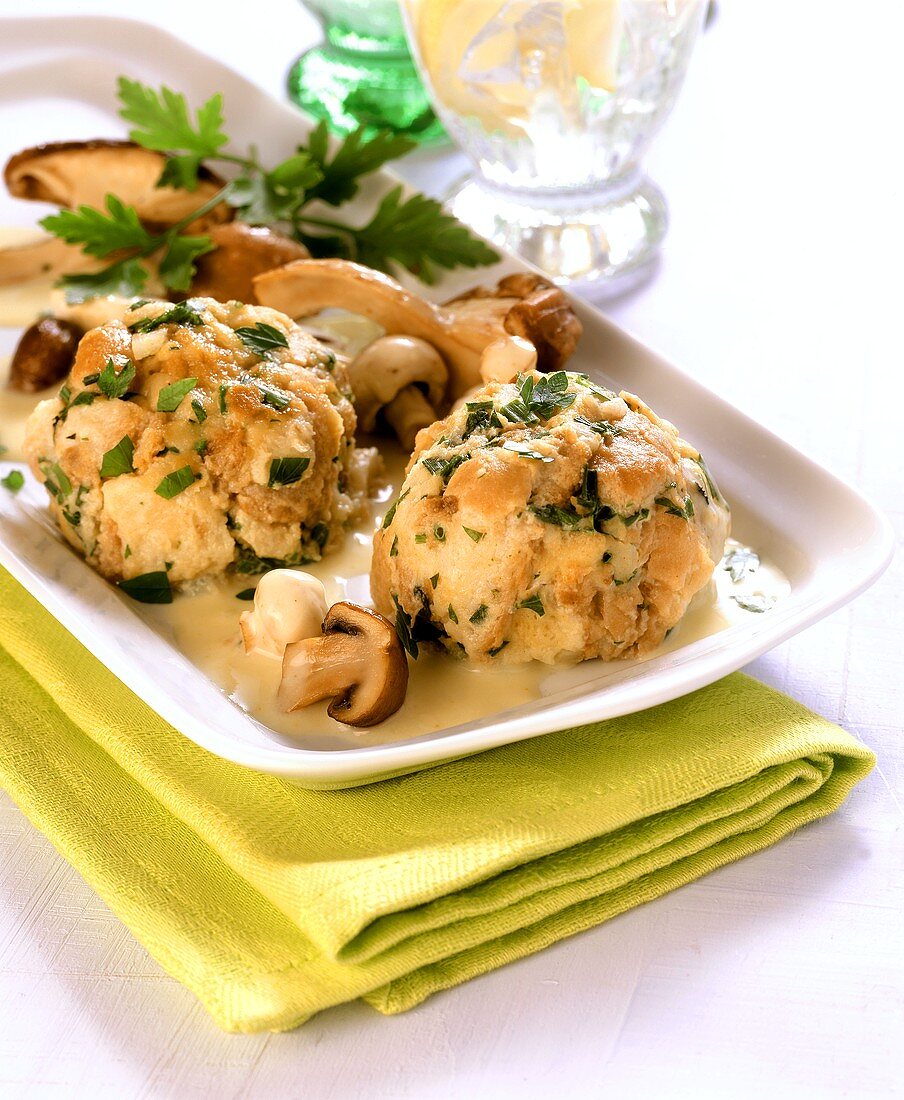 Herb dumplings with mushroom sauce