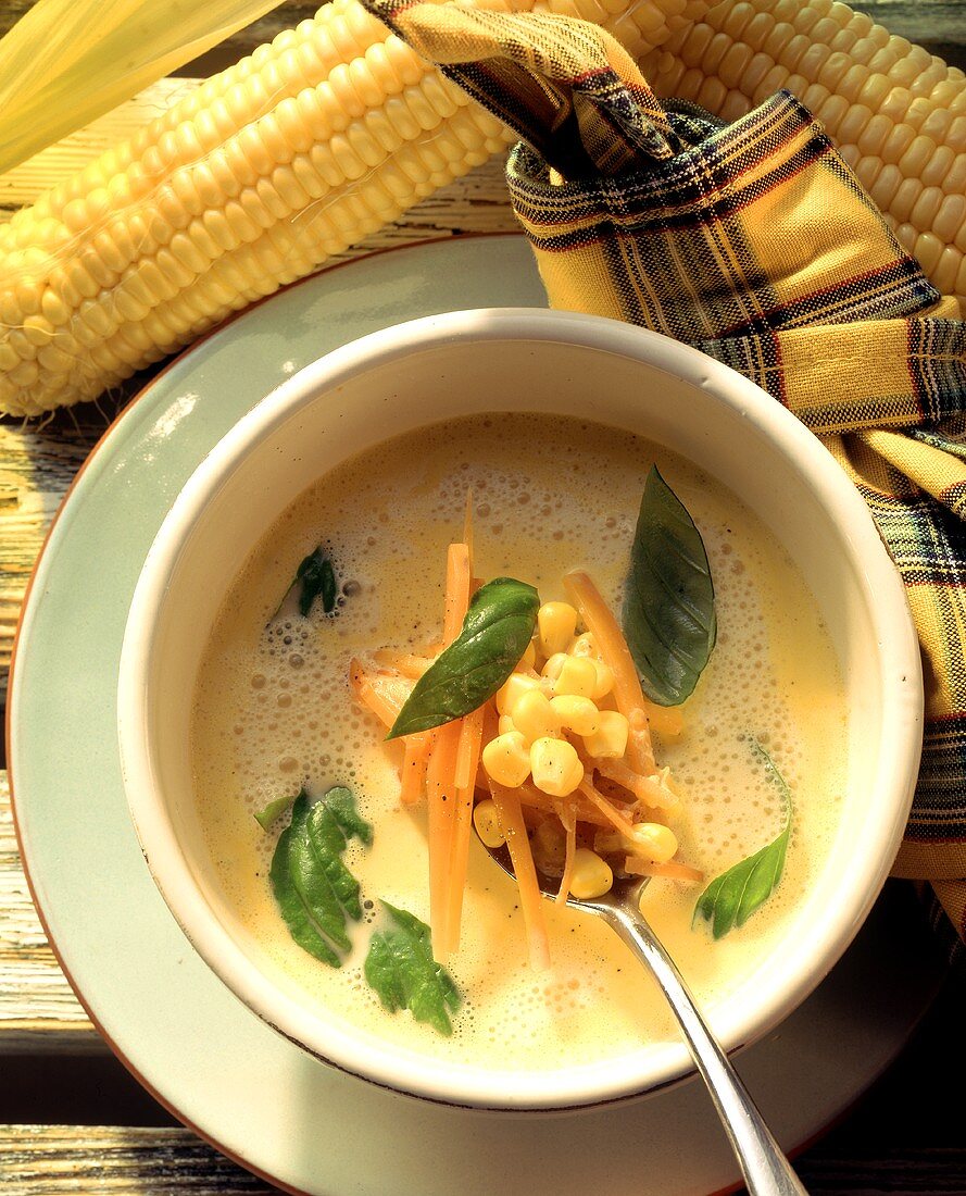 Sweetcorn soup with carrots and basil