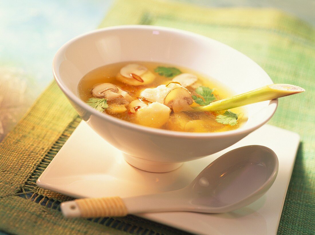 Clear broth with mushrooms and salmon dumplings