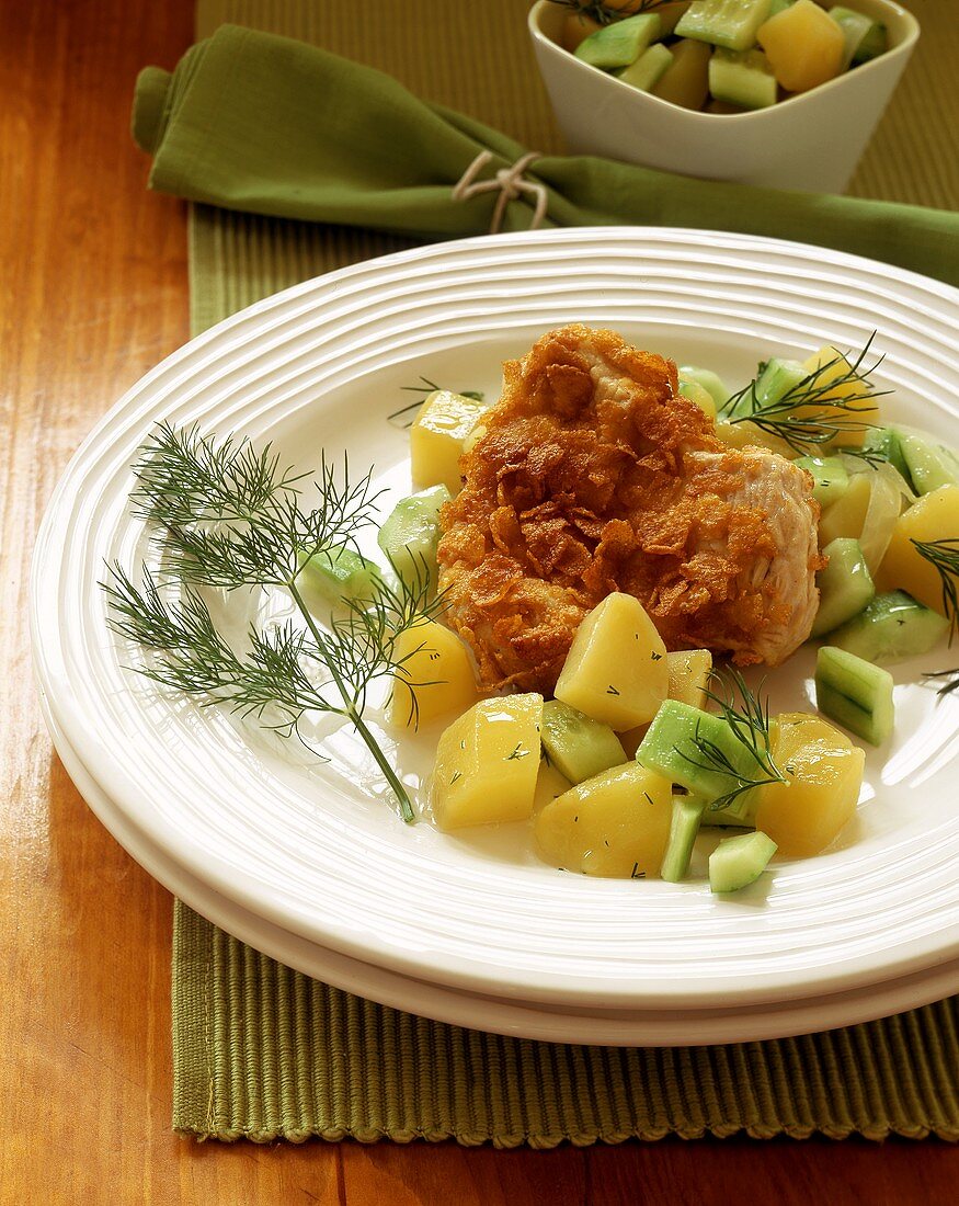 Turkey escalope in crispy coating with potatoes & cucumber