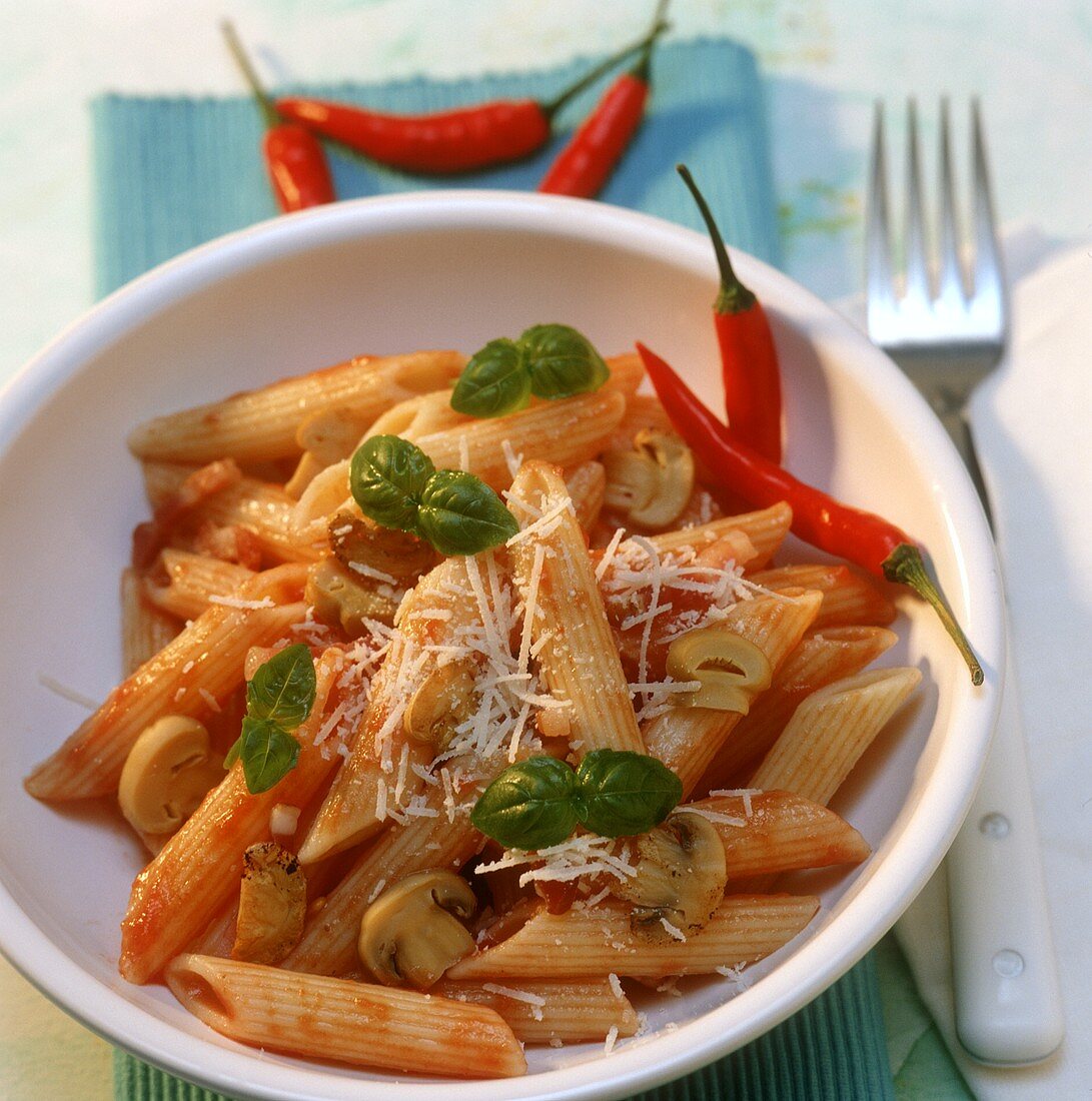 Penne all' arrabiata with chili peppers and mushrooms