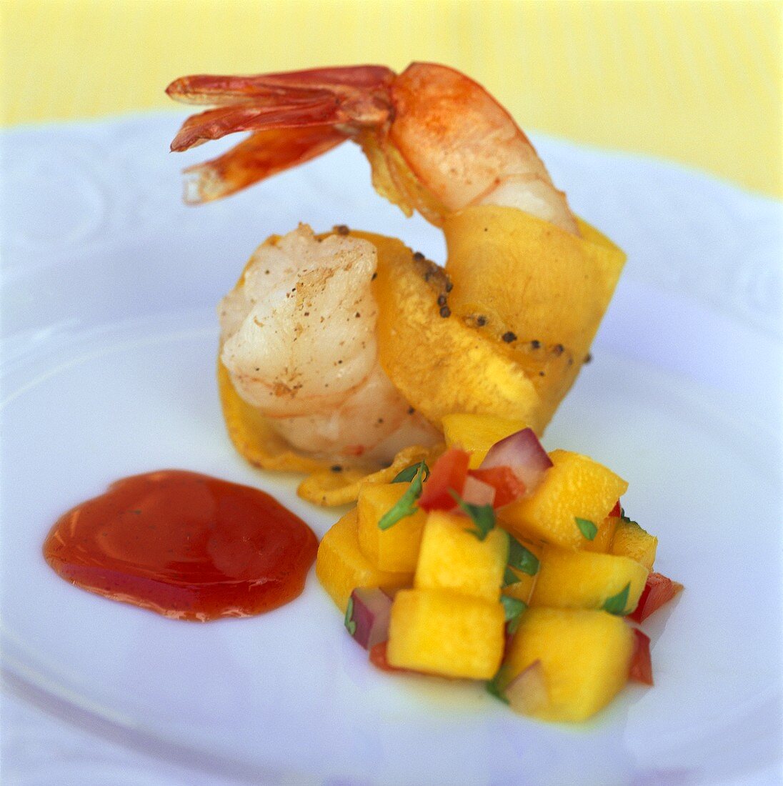 Shrimp with mango salsa and passion fruit sauce