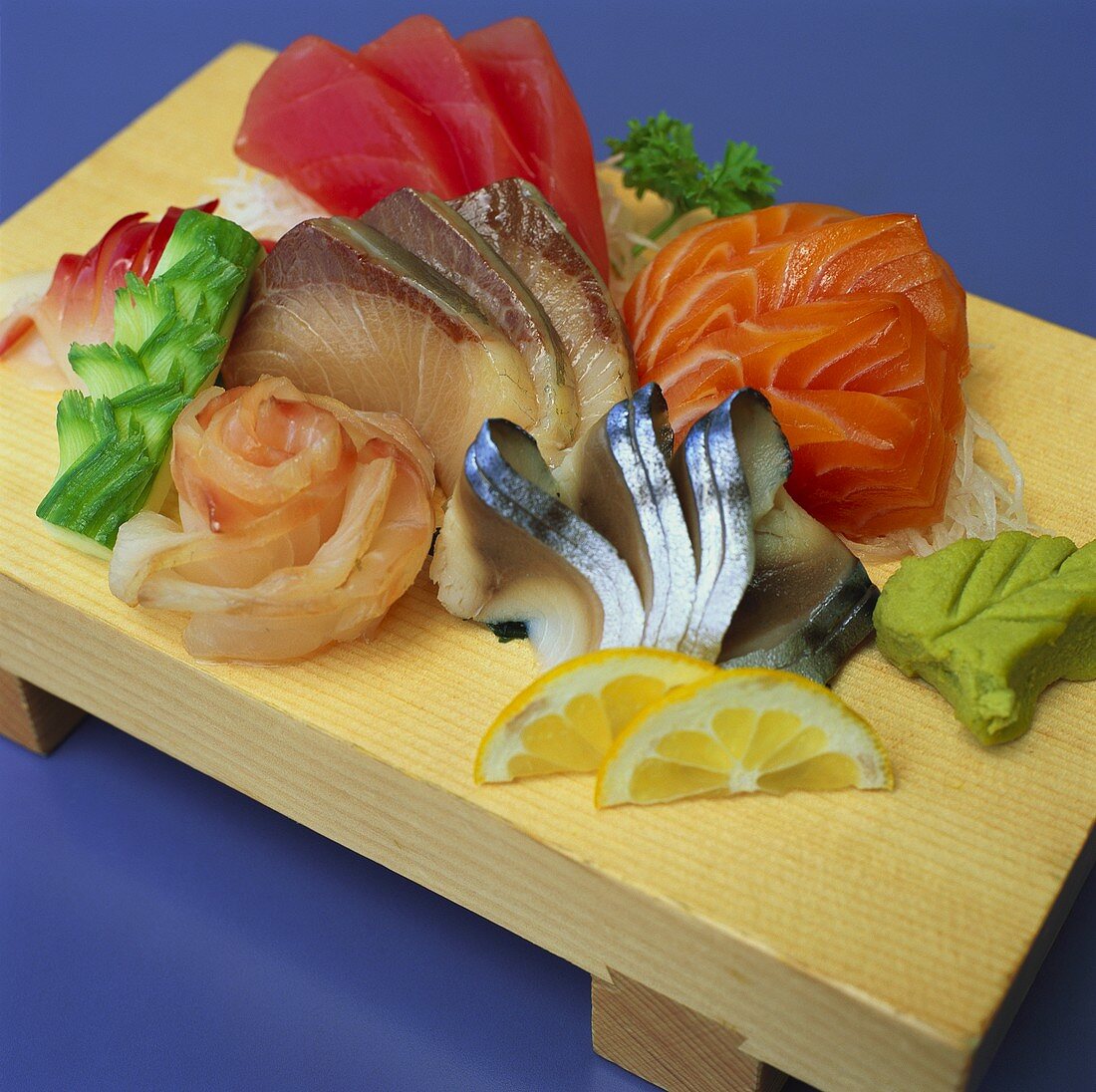 Sashimi with wasabi on wooden board