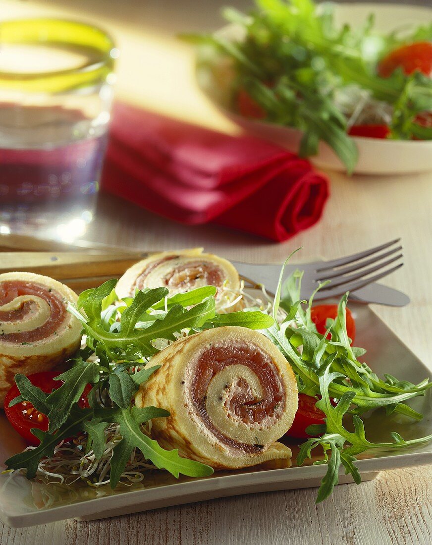 Pancake roulade with marinated salmon and rocket salad