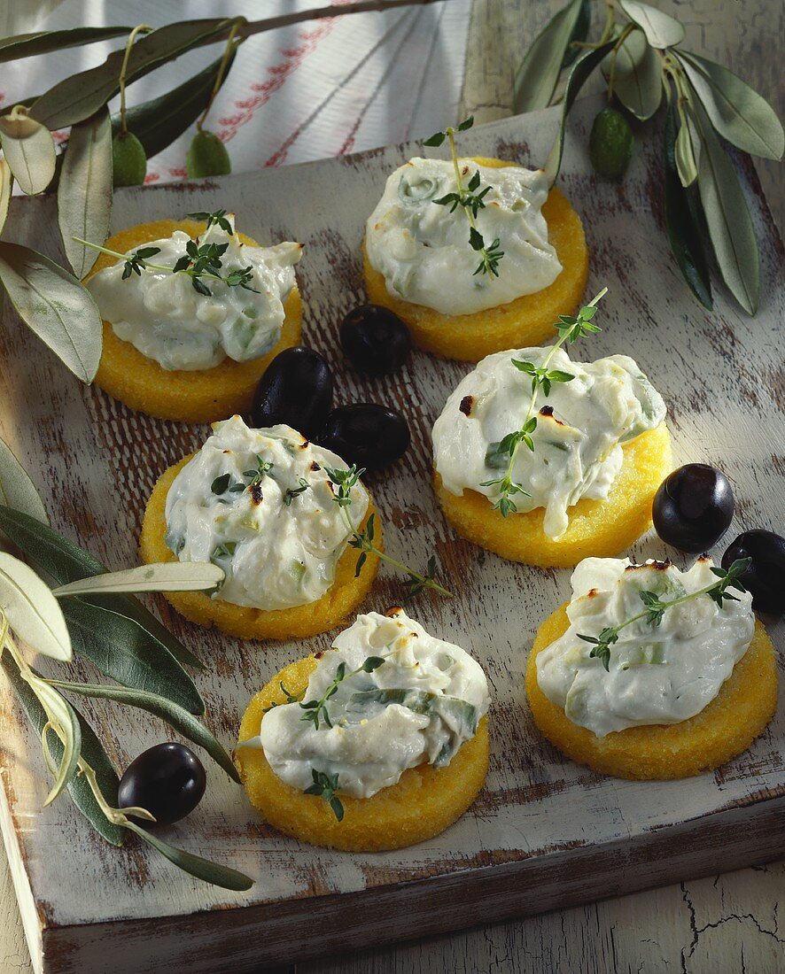 Polenta rounds with toasted goat's cheese & olives