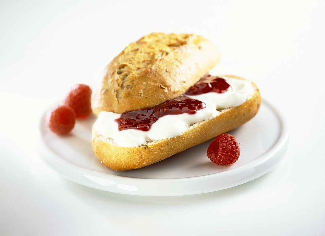 Baguette roll with quark and raspberry jam