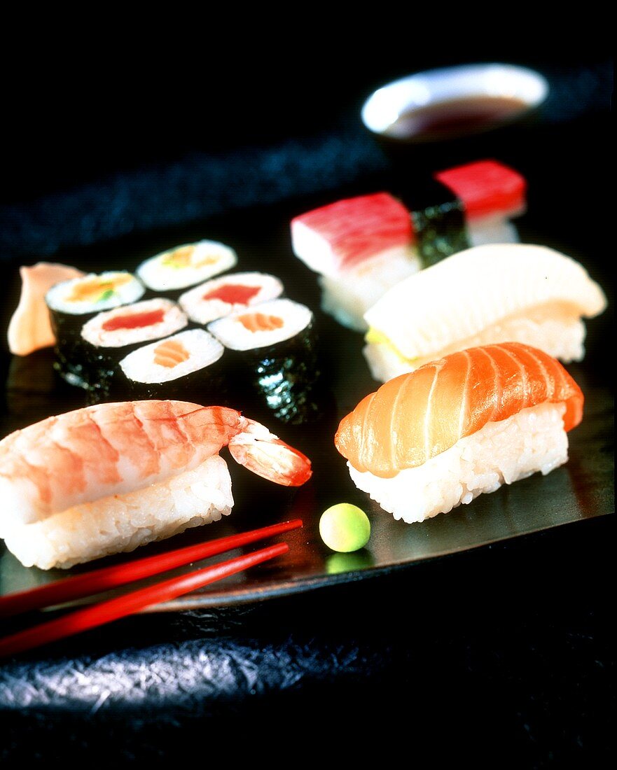Sushi platter with wasabi, soy sauce and ginger