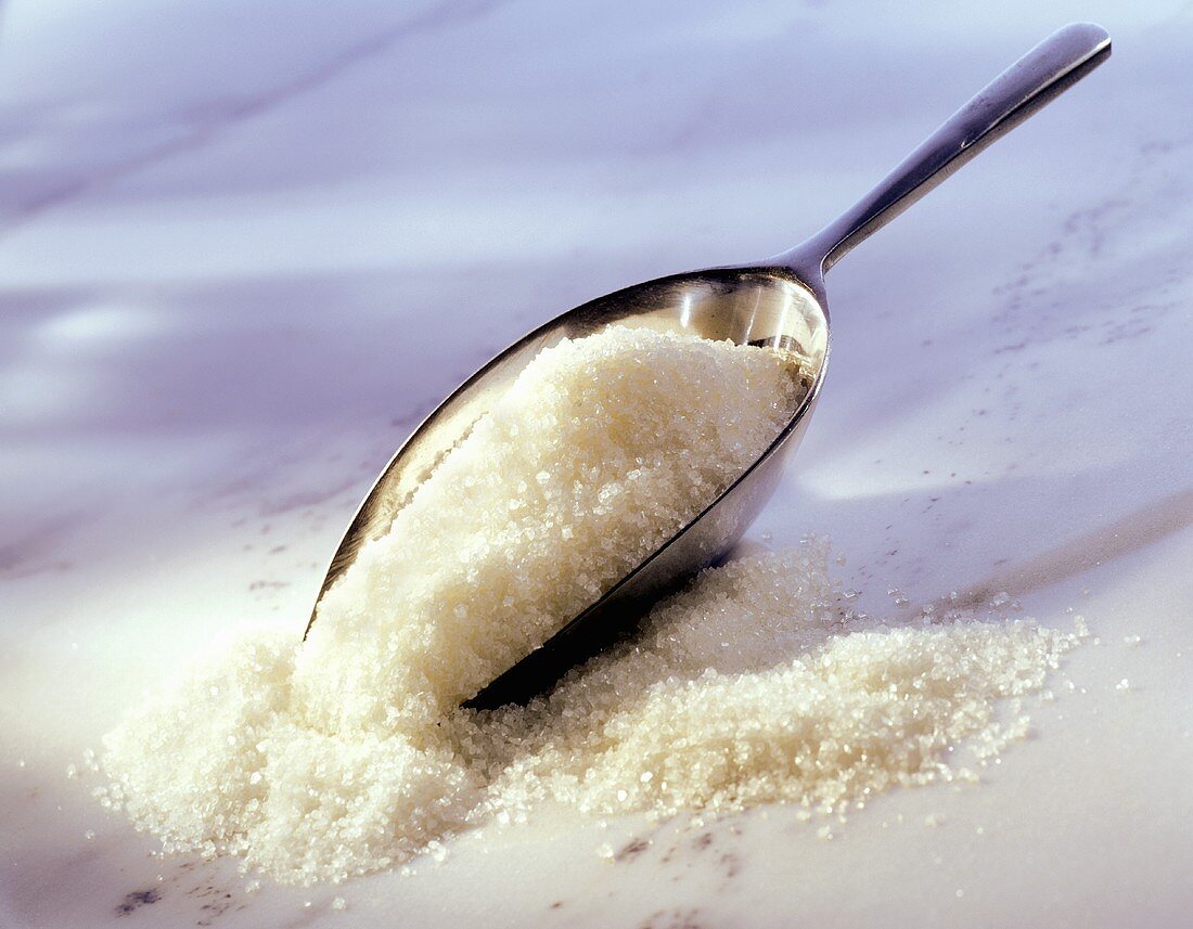 Preserving sugar with metal scoop