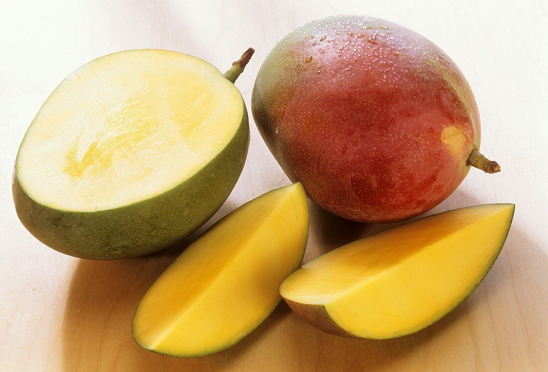 Mangos (Keitt variety) with drops of water