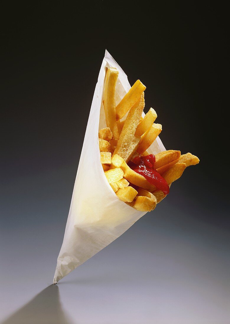 Chips with ketchup in paper bag